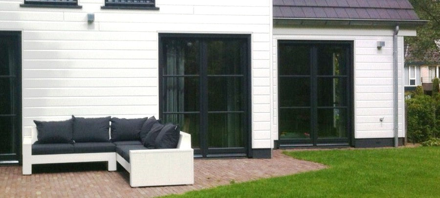 Custom corner sofa made of scaffolding wood